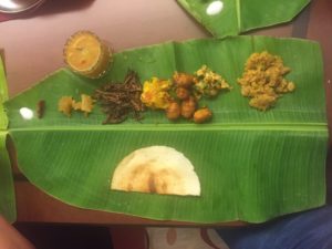 Banana leaf with indian dinner dishes