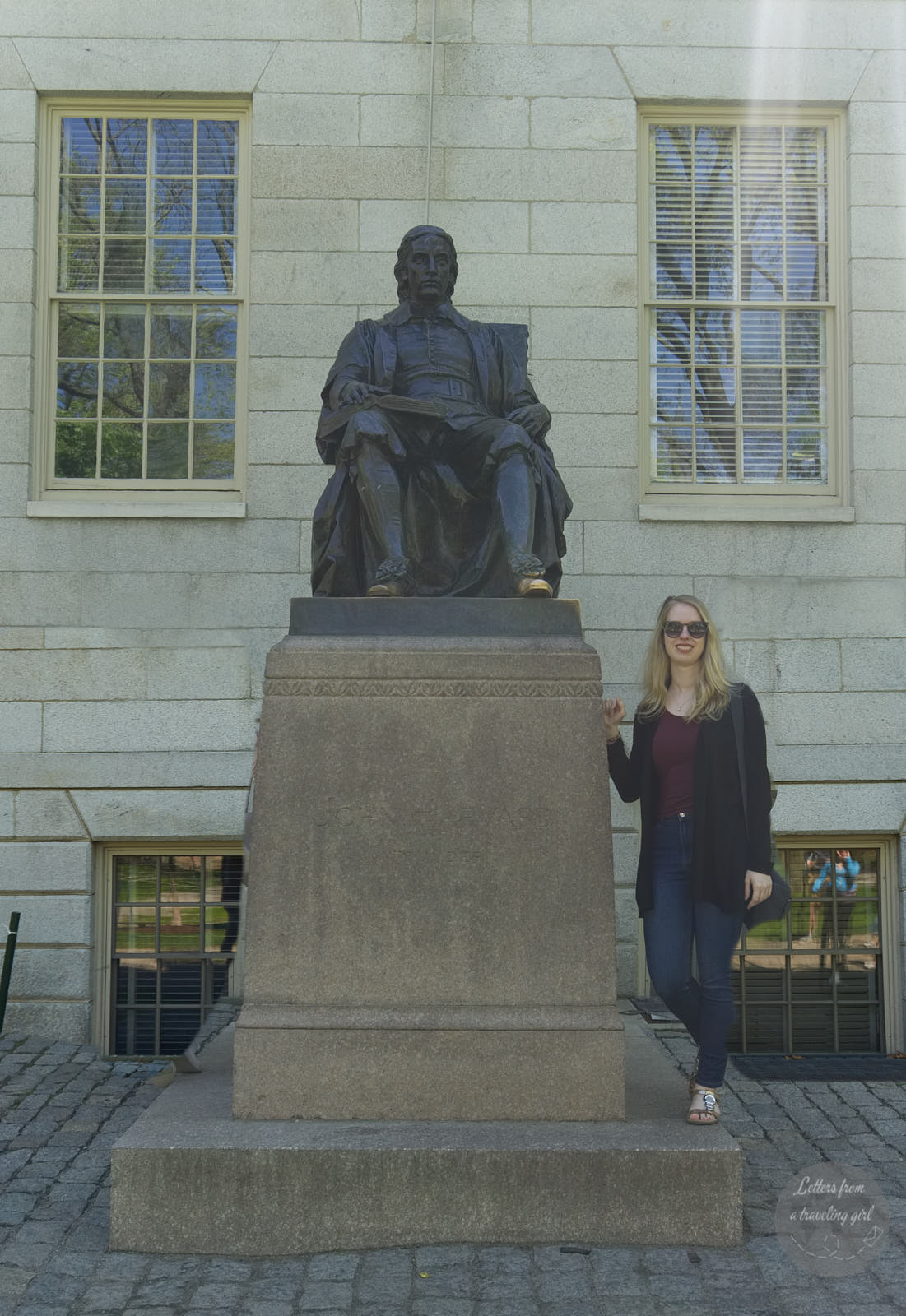 Statue of founder of Harvard and me standing next to it